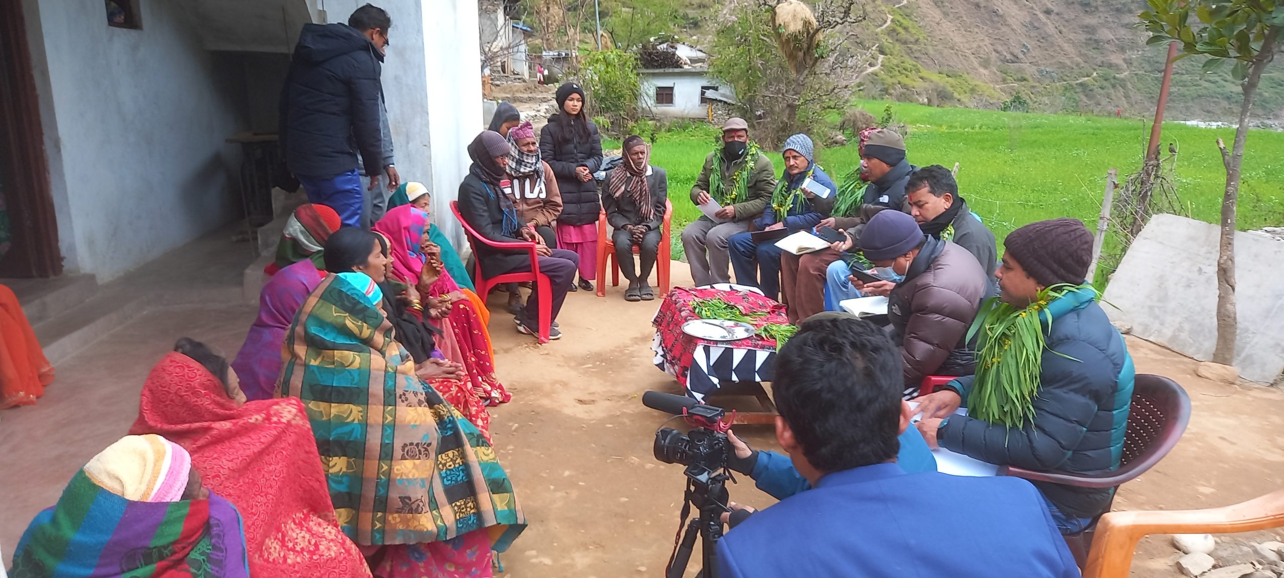 People sitting in circle in Nepali village