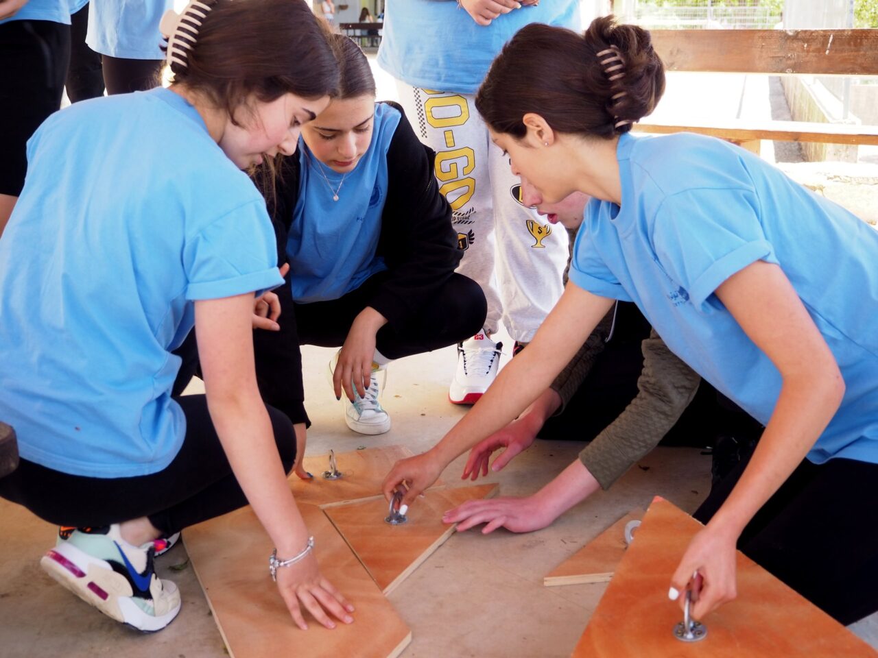 Young people solving a puzzle together.